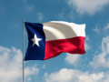 Texas state flag waving in the sky