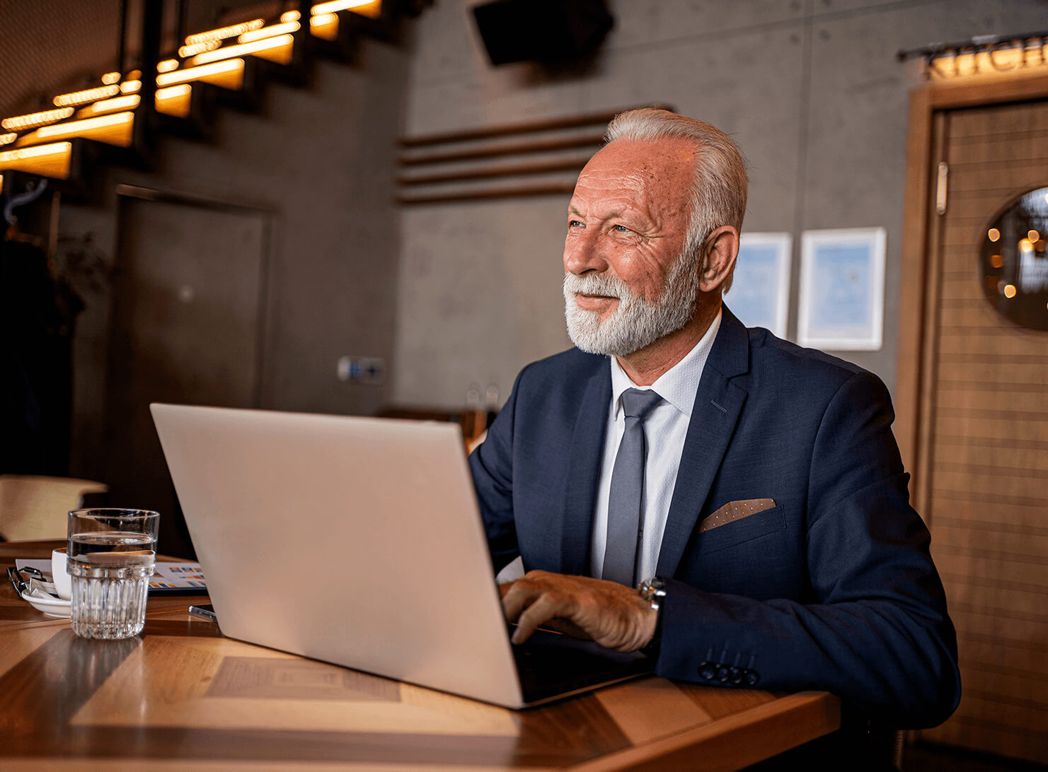 Man in suit working on computer