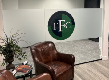 Frank Financial Concepts office with FFC text in logo circle on glass door